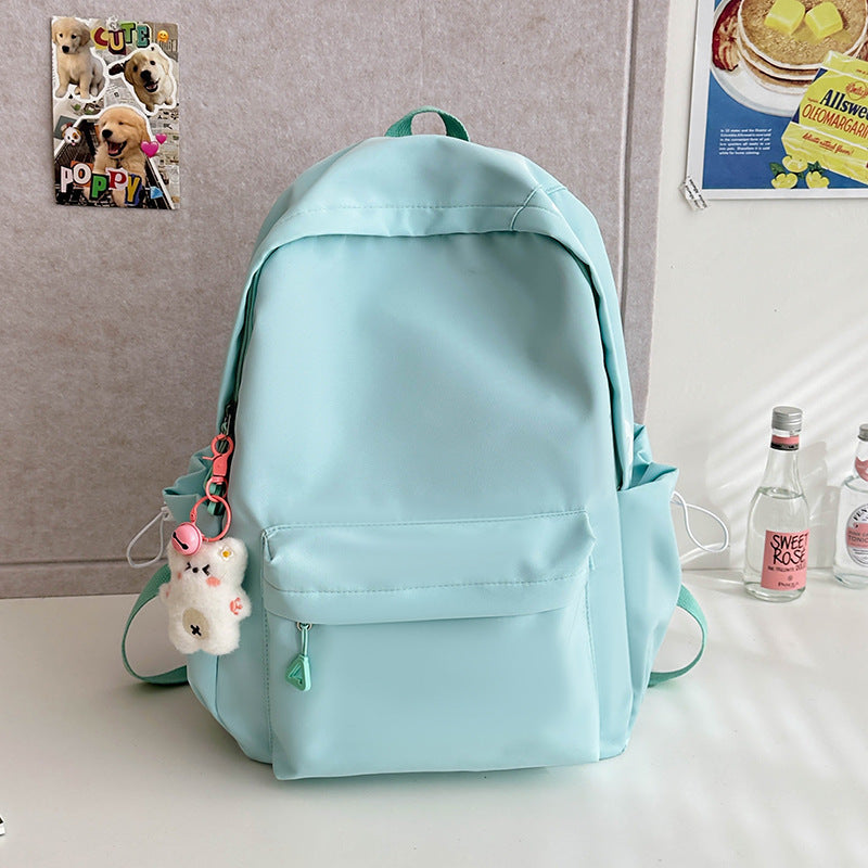 2025 Japanese simple and versatile backpack large capacity solid color campus schoolbag light commuter college student design backpack