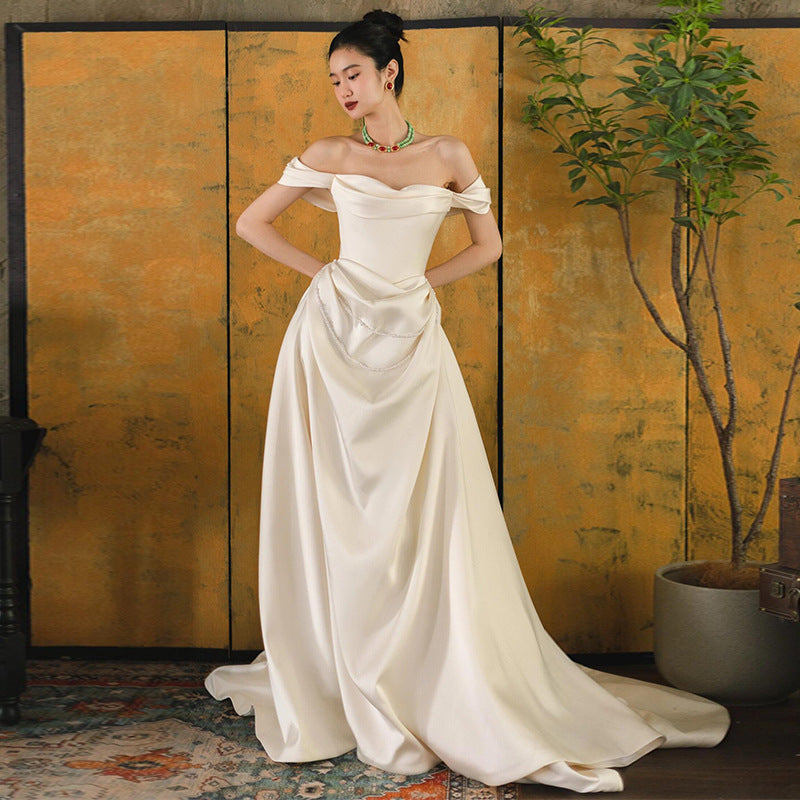 2025 one-word shoulder light wedding dress bride simple going out dress high-end temperament small trailing white satin dress skirt