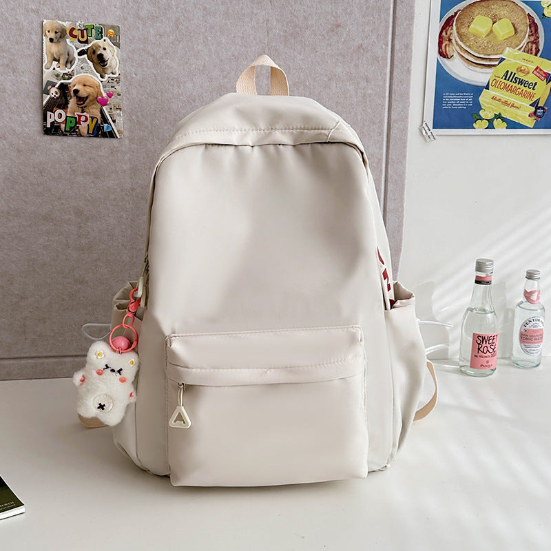 2025 Japanese simple and versatile backpack large capacity solid color campus schoolbag light commuter college student design backpack