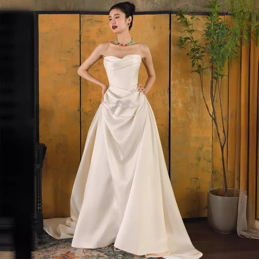 2025 one-word shoulder light wedding dress bride simple going out dress high-end temperament small trailing white satin dress skirt