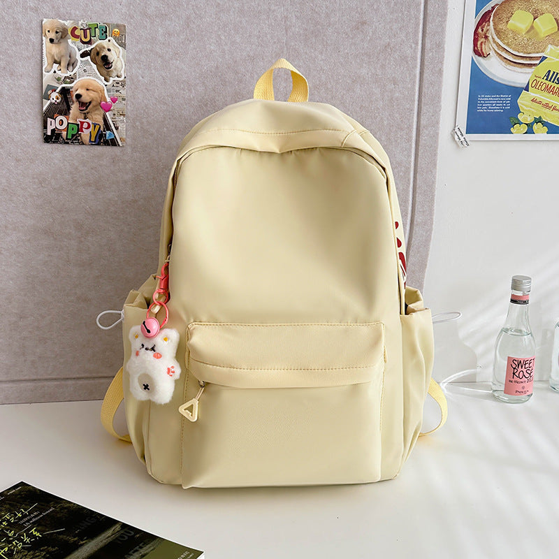 2025 Japanese simple and versatile backpack large capacity solid color campus schoolbag light commuter college student design backpack