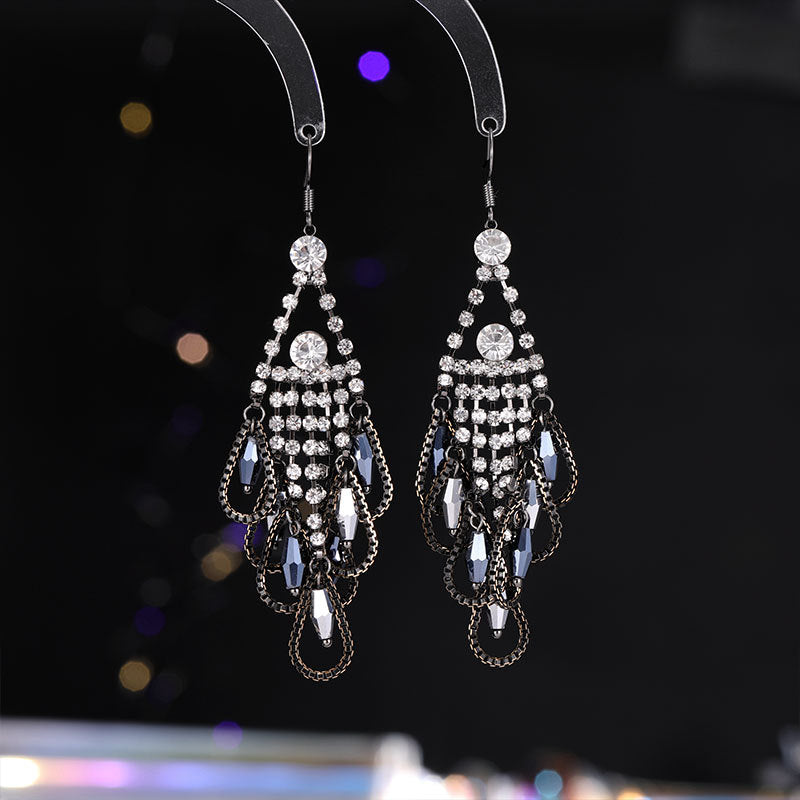 2025 Retro ethnic style exaggerated earrings long female temperament bohemian elegance water drop fringed feather earrings