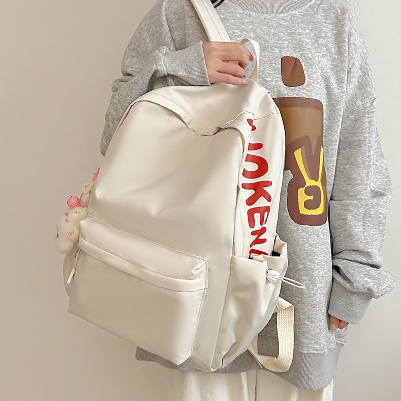 2025 Japanese simple and versatile backpack large capacity solid color campus schoolbag light commuter college student design backpack