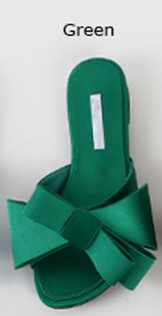 Wearing flat slippers women's shoes Korean version of the summer new large bow satin round head sandals Wild half slippers