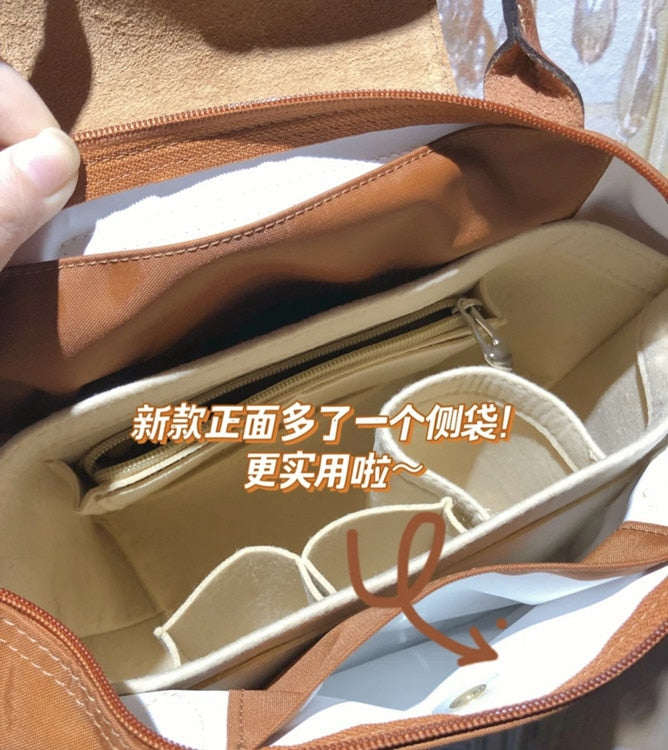 Autumn and winter new nylon cognac color dumpling bag women's portable shoulder bag cowhide leather mummy bag