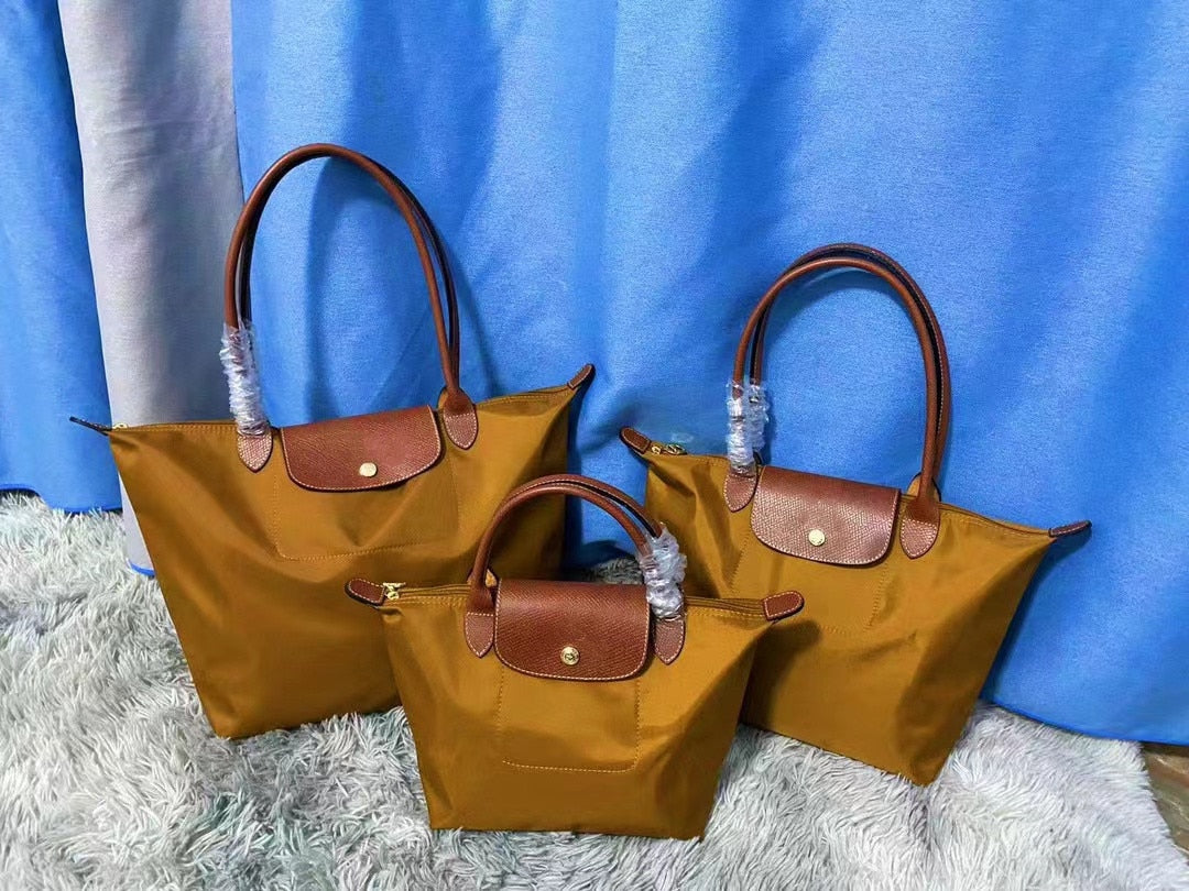 Autumn and winter new nylon cognac color dumpling bag women's portable shoulder bag cowhide leather mummy bag