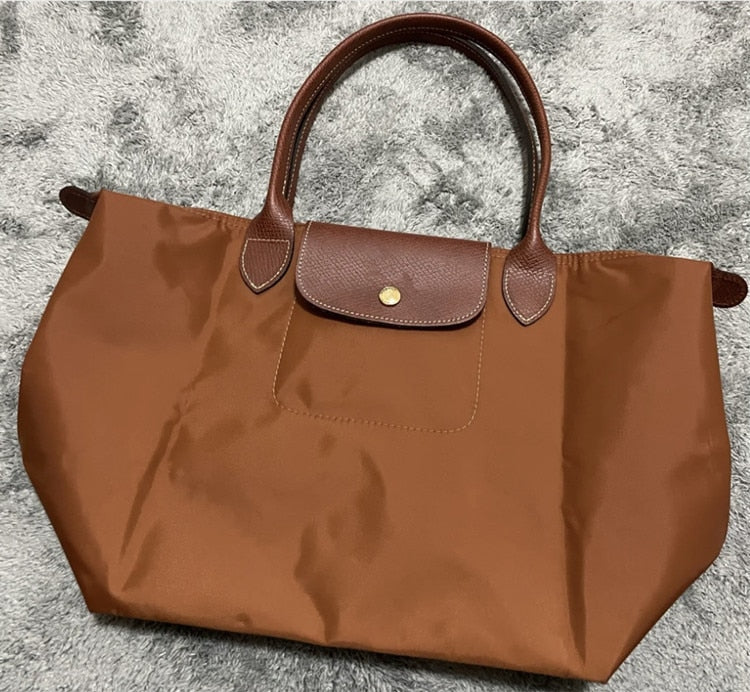 Autumn and winter new nylon cognac color dumpling bag women's portable shoulder bag cowhide leather mummy bag