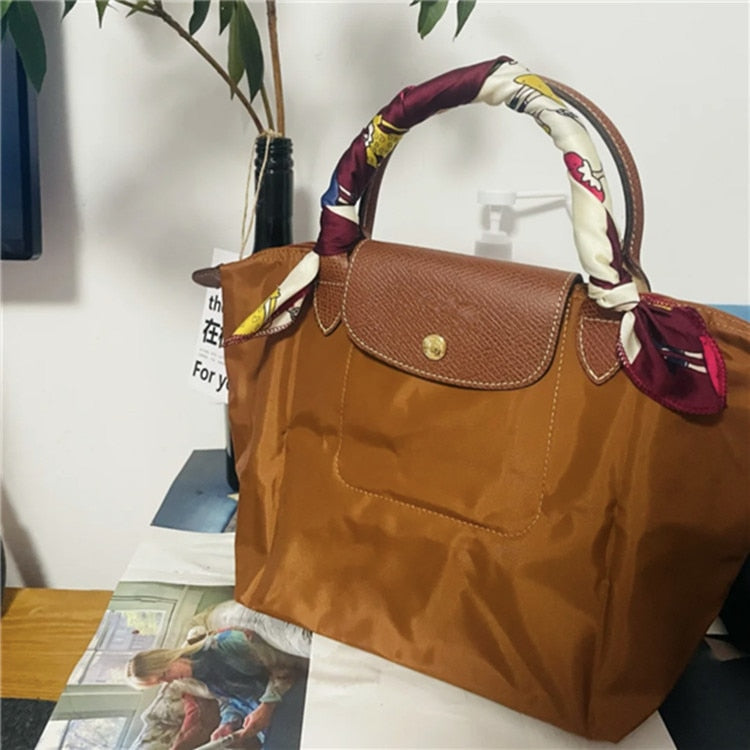 Autumn and winter new nylon cognac color dumpling bag women's portable shoulder bag cowhide leather mummy bag