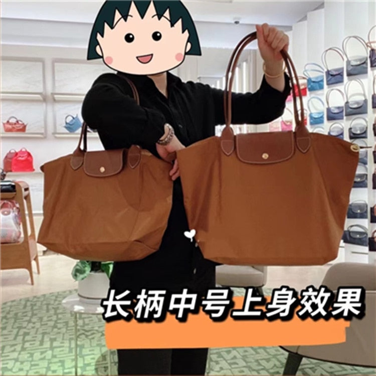 Autumn and winter new nylon cognac color dumpling bag women's portable shoulder bag cowhide leather mummy bag