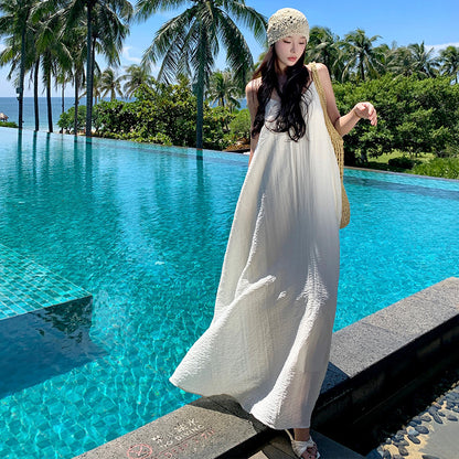 2025 Seaside vacation dress travel photo atmosphere lazy wind halter sling beach dress big swing skirt with chest pad