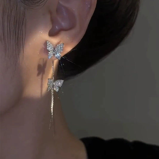 Super fairy temperament full of diamond butterfly stud earrings for women showing their faces, thin and long fringed earrings, Korean version of personalized light luxury two earrings