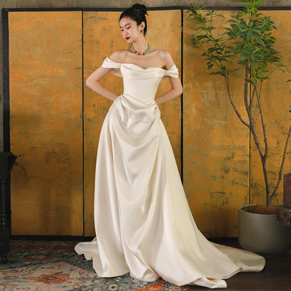 2025 one-word shoulder light wedding dress bride simple going out dress high-end temperament small trailing white satin dress skirt