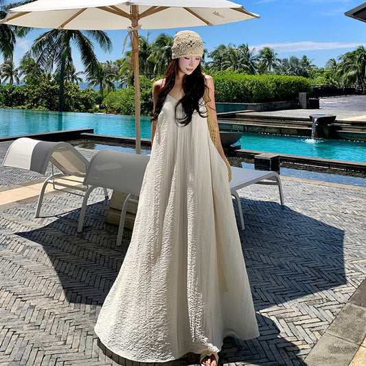 2025 Seaside vacation dress travel photo atmosphere lazy wind halter sling beach dress big swing skirt with chest pad