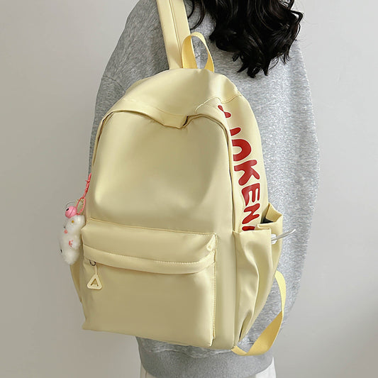 2025 Japanese simple and versatile backpack large capacity solid color campus schoolbag light commuter college student design backpack