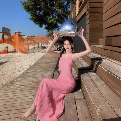 2025 Dopamine pink backless small suspender dress women's summer Thai style Dali Sanya seaside vacation beach long skirt