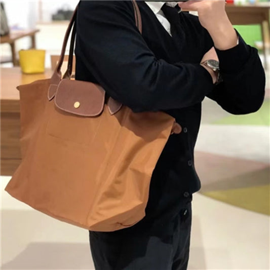 Autumn and winter new nylon cognac color dumpling bag women&#39;s  portable shoulder bag cowhide leather mummy bag